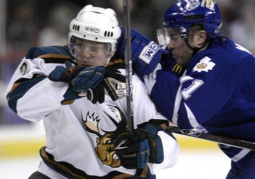 John Woods / Winnipeg Free Press / April 13/07- 070413  - Manitoba Moose Colby Genoway (29) tries to break free of Toronto's Marc Moro (11) in the second period of their AHL game in Winnipeg April 13/07.