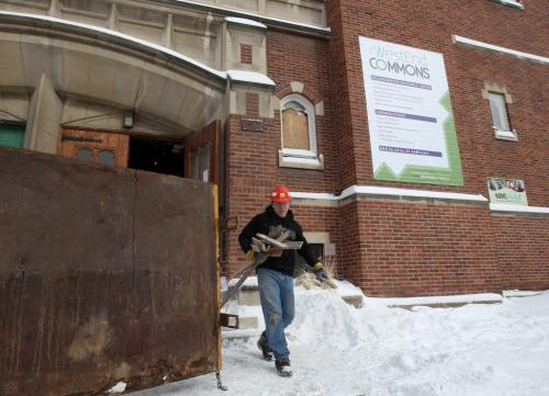 Worker carries out hardwood from St Matthewss Anglican Church which is being redesigned for The West End Commons  a 24 suite non profit housing projectsee Brenda Suderman faith story- March 05, 2013   (JOE BRYKSA / WINNIPEG FREE PRESS)