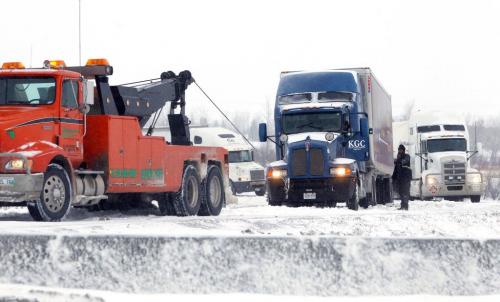 Trucks loose traction on the perimeter highway onramp off #1 highway on the east side of the city. March 5, 2013  BORIS MINKEVICH / WINNIPEG FREE PRESS