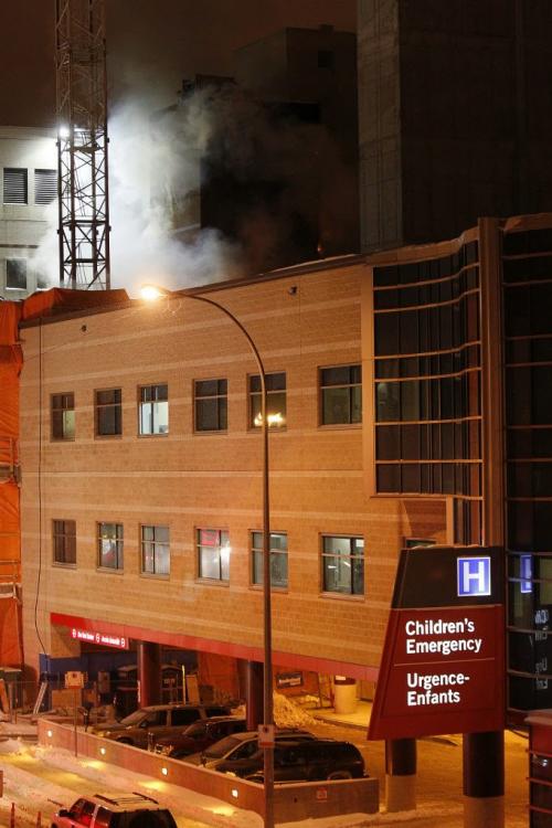 Firefighters fight a fire in the wing of the Children's Hospital currently under construction Tuesday, March 5, 2015. John Woods / Winnipeg Free Press