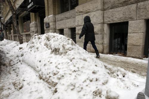 piles of snow and slush  on Princess ST. - Walking the Slippery Walk  in downtown Wpg , unploughed  sidewalks , slushy  snow conditions making walking difficult after the large snow fall of the past week- gordon sinclair story - KEN GIGLIOTTI / Mar. 6 2013 / WINNIPEG FREE PRESS