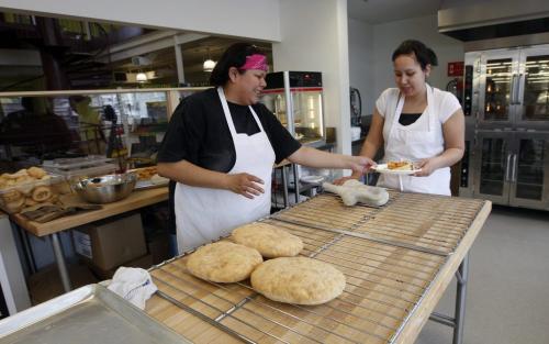 left  open for business - Diana Atkinson and left Arlene Peebles  are bakers in the Bannock Pizza Resturaunt  at Neechi Commons Community Business Complex  - prepare for   grand opening March 19 , the Commons food store is open for business  but the sheleve are fully stocked Äì Murray McNeill story -  KEN GIGLIOTTI / Mar. 6 2013 / WINNIPEG FREE PRESS