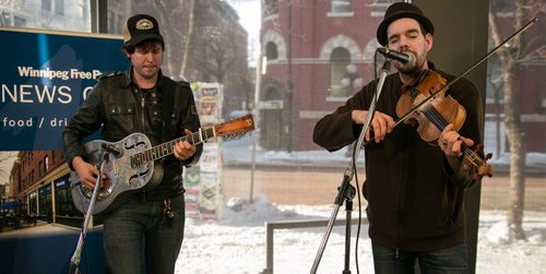 Champagne James Robertson (left) and John Showman, half of alt-country band New Country Rehab, perform at the Winnipeg Free Press News Café Thursday afternoon. (Tyler Walsh / Winnipeg Free Press)