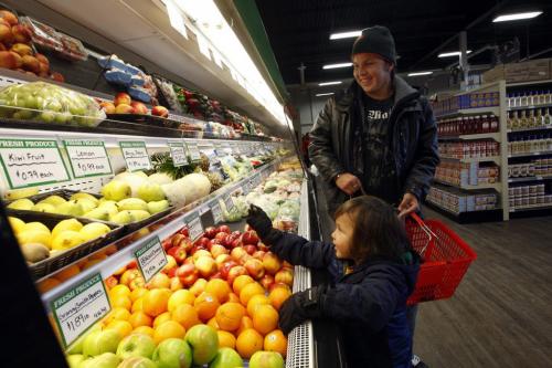 Andrew Guimond  with his son Aiden age 4  shop for fresh produce  at the Superstore grocery  located in the same building as the new Tim's on the Sagkeeng  First Nation -Story by Bill Redekop . KEN GIGLIOTTI / Mar. 7 2013 / WINNIPEG FREE PRESS
