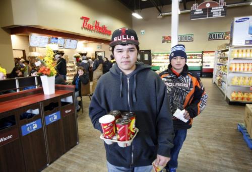 LtoR Tray Guimond age 16 and  cousin Anthony Guimond age 14 make a Tim's run , picking up coffee for his grandfather at the newly opened Sagkeeng Tim Hortons's and Superstore grocery  on the first nation. Story by Bill Redekop . KEN GIGLIOTTI / Mar. 7 2013 / WINNIPEG FREE PRESS