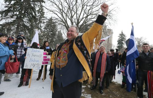 Manitoba M¾©tis Federation president David Chartrand celebrates at St. Boniface Cathedral Cemetery near the gravesite of M¾©tis leader Louis Riel on Sat., March 9, 2013, one day after the the Supreme Court ruled the federal government was "ineffectual and inequitable" in how it handed out land to M¾©tis children in Manitoba more than 130 years ago. Photo by Jason Halstead/Winnipeg Free Press