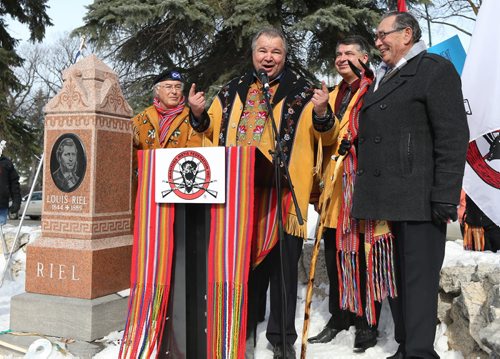 Manitoba M¾©tis Federation president David Chartrand, MMF past-president John Morrisseau (right) and other celebrate at St. Boniface Cathedral Cemetery and the gravesite of M¾©tis Leader Louis Riel on Sat., March 9, 2013, one day after the the Supreme Court ruled the federal government was "ineffectual and inequitable" in how it handed out land to M¾©tis children in Manitoba more than 130 years ago. Photo by Jason Halstead/Winnipeg Free Press