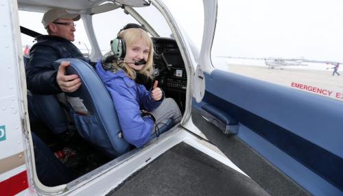 Winnipegger Claire Olfert, 10, gives a thumbs up after taking a flight with her mom Robyn and pilot Peter Moodie and his Cherokee Warrior aircraft at the ÄúWomen FlyÄù International WomenÄôs Day event at St. Andrews Airport north of Winnipeg, on on Sat., March 9, 2013. Photo by Jason Halstead/Winnipeg Free Press