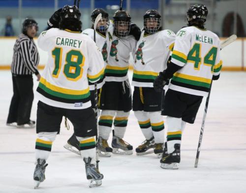 Graham Philp, middle, of the John Taylor Pipers, celebrates with his line after scoring what would be the game winning goal against the Morden Thunder, in the 2013 AAA High School Hockey semi finals at the St.James Civic Centre, Saturday, March 9, 2013. ( TREVOR HAGAN/WINNIPEG FREE PRESS)