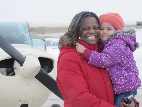 STEPH CROSIER / WINNIPEG FREE PRESS 
Susan Lachance and three-year-old Cali, had their first flight in a Cessna at the first Women Fly held at St. Andrews Airport Saturday. Susan said linking their toy planes at home to an actual flight is a great experience for her daughter. March 9, 2013