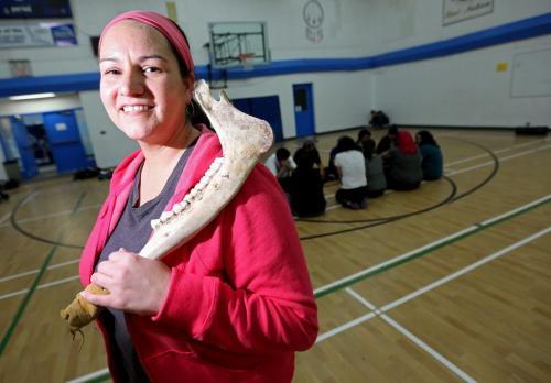 Christine Cyr who recently received the education award from Future Leaders of Manitoba, at Southeast Collegiate with an instructor teaching about Traditional Aboriginal Sports And Games.  Saturday, March 9, 2013. (TREVOR HAGAN/WINNIPEG FREE PRESS) - volunteer column