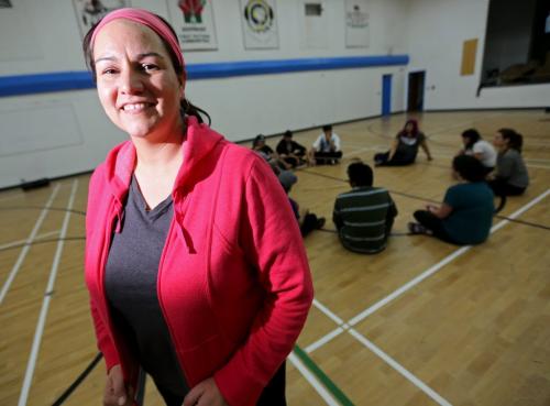 Christine Cyr who recently received the education award from Future Leaders of Manitoba, at Southeast Collegiate with an instructor teaching about Traditional Aboriginal Sports And Games.  Saturday, March 9, 2013. (TREVOR HAGAN/WINNIPEG FREE PRESS) - volunteer column