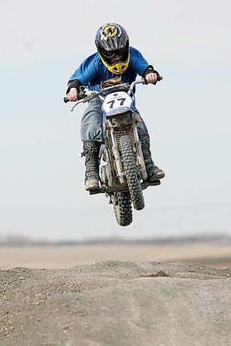 BORIS MINKEVICH / WINNIPEG FREE PRESS 070415 Seven year old Riley Caie rips it up near the Floodway and Highway 59 north of the city.