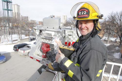 Chad Swayze gets takes the first donation from the boot at the Fire Fighter CAMPOUT for Muscular Dystrophy at the Osborne Street Fire Hall #4. March 12, 2013  BORIS MINKEVICH / WINNIPEG FREE PRESS