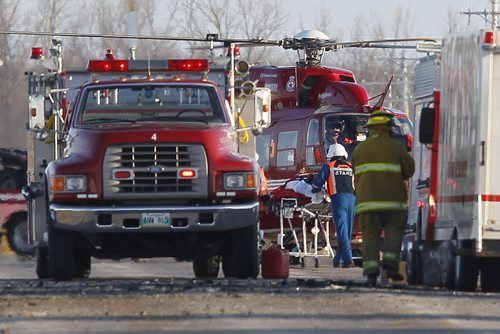 March 12, 2013 - 130312  -  Emergency crews and STARS extricate the victim of a car/semi mvc just north of St Malo on highway 59 Tuesday, March 12, 2013. John Woods / Winnipeg Free Press