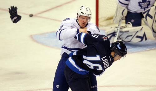 Captians fight it out, Winnipeg Jet Andrew Ladd and Maple Leaf Dion Phaneuf duke it out  Monday night at the MTS Center in 1st period action. March 13, 2013 - (Phil Hossack / Winnipeg Free Press)