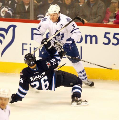 Maple Leaf Captain Dion Phaneuf takes down Winnipeg Jet's Blake Wheeler Monday night at the MTS Center's 2nd period. March 13, 2013 - (Phil Hossack / Winnipeg Free Press)