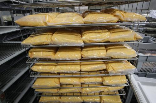 Bags of Mac and Cheese sit in racks defrosting during a tour of the Regional Distribution Facility at the WRHA Nutrition and Food Services Centre at 345 De Baets Street in St. Boniface.  130312 - Tuesday, March 12, 2013 -  (MIKE DEAL / WINNIPEG FREE PRESS)