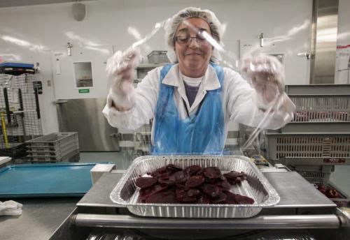 Gwen Court and Inventory Control Clerk wraps up some sliced beats during a tour of the Regional Distribution Facility at the WRHA Nutrition and Food Services Centre at 345 De Baets Street in St. Boniface.  130312 - Tuesday, March 12, 2013 -  (MIKE DEAL / WINNIPEG FREE PRESS)