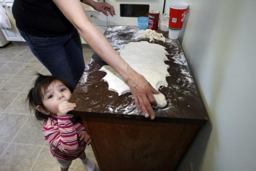 Althea Guiboche  with daughter Aralyn age 2 ,makes Bannock in her home  and hands it to  people on the street Äì  geoff kirbyson story  KEN GIGLIOTTI / Mar. 12 2013 / WINNIPEG FREE PRESS