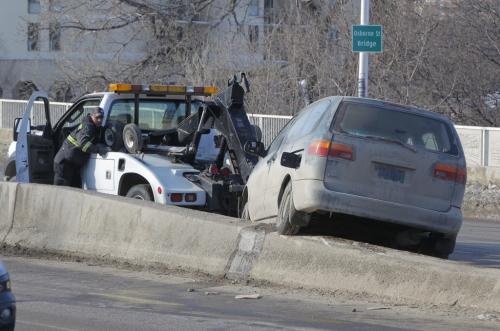 A van got stuck on the medium at the north side on the Osborne St. Bridge. MVC. MVA. No other information. March 14, 2013  BORIS MINKEVICH / WINNIPEG FREE PRESS