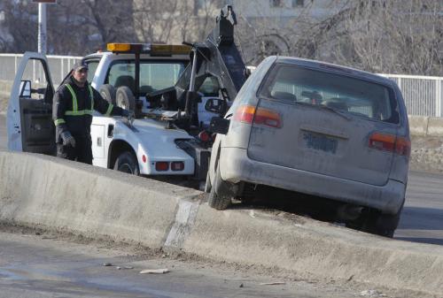 A van got stuck on the medium at the north side on the Osborne St. Bridge. MVC. MVA. No other information. March 14, 2013  BORIS MINKEVICH / WINNIPEG FREE PRESS