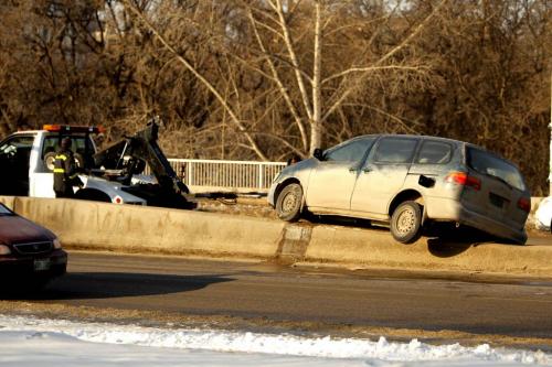 A van got stuck on the medium at the north side on the Osborne St. Bridge. MVC. MVA. No other information. March 14, 2013  BORIS MINKEVICH / WINNIPEG FREE PRESS