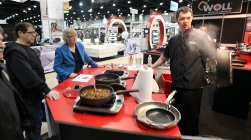 Home Show patrons at the Winnipeg Convention Center watch a demonstration of stick free cookware Friday afternoon as the annual display of home improvements got underway.....March 15, 2013 - (Phil Hossack / Winnipeg Free Press)