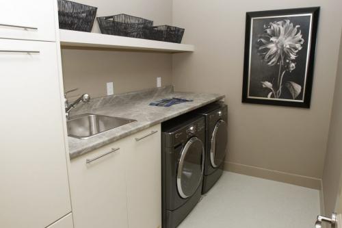 The Health Sciences Centre Foundation Home Lottery Grand Prize is a Tuxedo neighbourhood show home at 137 Aldershot Blvd. valued at $1.4 million and features almost 5,000 square feet of living space. Pictured is the laundry room on March 15, 2013. (REPORTER: TODD LEWYS) (JESSICA BURTNICK/WINNIPEG FREE PRESS)
