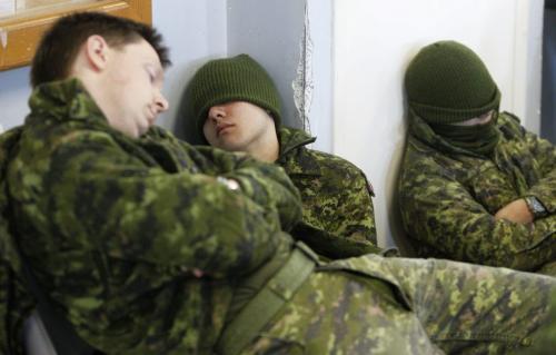Some members of one of sixteen military teams resting as they wait to participate in the T. Eaton Cup Äì Military Skills Competition at St. Charles Ranges just outside Winnipeg (in Headingley). Sixteen military teams from 38 CBG and the US will be compete in timed events such as live fire, navigation and overcoming obstacles. , Saturday, March 16, 2013. ( TREVOR HAGAN/WINNIPEG FREE PRESS)