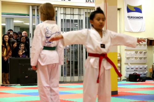 Thirteen family members look on as Anthony Contreras, 6, right, tested for his poom, or junior black belt in taekwondo at Choi's Taekwondo in Garden City Mall, Saturday, March 16, 2013. A very rare feat for someone this young. (TREVOR HAGAN/WINNIPEG FREE PRESS)