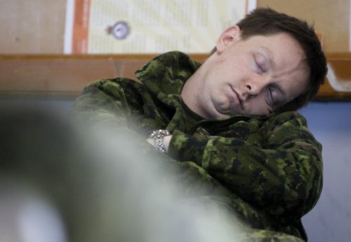 Members of 16 military teams from the 38 CBG and the US were competing in the T. Eaton Cup Military Skills Competition at the St. Charles Range, in Headingley, Saturday, March 16, 2013. Teams arrived at the range at 5am, and this participant rested while waiting for his turn. (TREVOR HAGAN/WINNIPEG FREE PRESS)