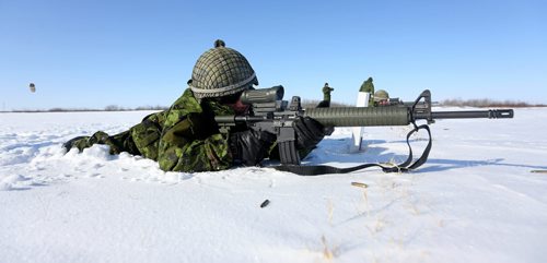 A spent cartridge is expelled from the gun being shot by Cpl. Tommy Wong, 21, of the Lake Superior Scottish Regiment as he fires at a target 100 yards away. Members of 16 military teams from the 38 CBG and the US were competing in the T. Eaton Cup Military Skills Competition at the St. Charles Range, in Headingley, Saturday, March 16, 2013. (TREVOR HAGAN/WINNIPEG FREE PRESS)