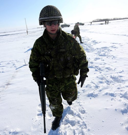 Cpl. Tommy Wong, 21, of the Lake Superior Scottish Regiment on the range. Members of 16 military teams from the 38 CBG and the US were competing in the T. Eaton Cup Military Skills Competition at the St. Charles Range, in Headingley, Saturday, March 16, 2013. (TREVOR HAGAN/WINNIPEG FREE PRESS)