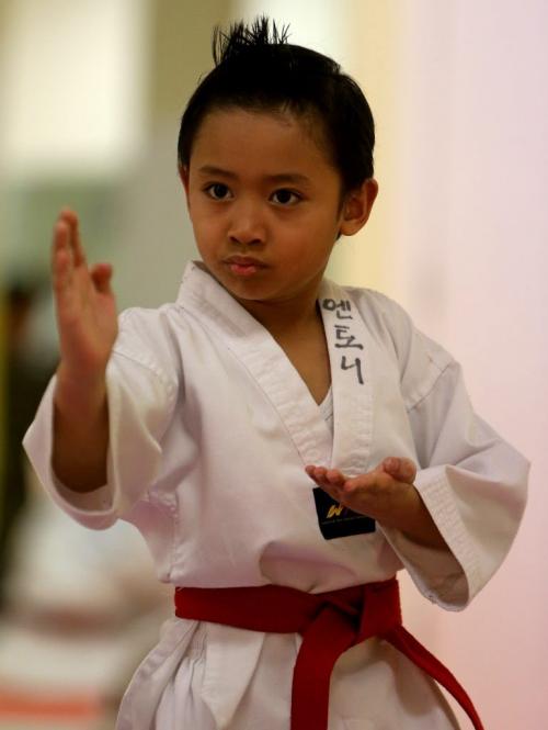 Anthony Contreras, 6, tests for his poom, or junior black belt in taekwondo at Choi's Taekwondo in Garden City Mall, Saturday, March 16, 2013. A very rare feat for someone this young. (TREVOR HAGAN/WINNIPEG FREE PRESS)