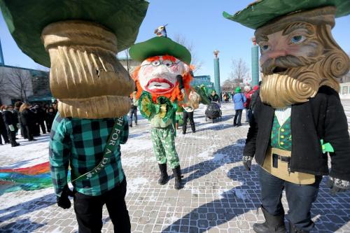 Three men in giant Leprechaun heads getting ready to walk in the St. Patricks Day Parade at The Forks, Saturday, March 16, 2013. (TREVOR HAGAN/WINNIPEG FREE PRESS)