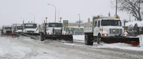 The artillery has arrived. Snowplows clear the way on McPhillips St. near Redwood Ave. as the snowfall continues on Monday morning. March 18, 2013. (JESSICA BURTNICK/WINNIPEG FREE PRESS)