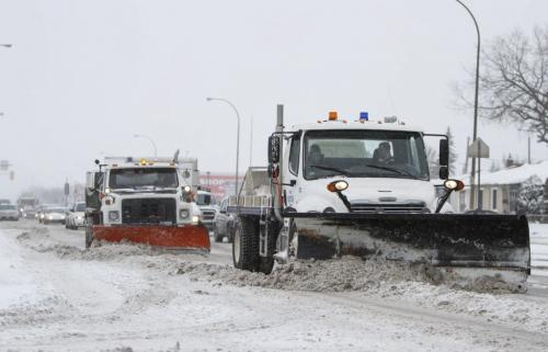 The artillery has arrived. Snowplows clear the way on McPhillips St. near Redwood Ave. as the snowfall continues on Monday morning. March 18, 2013. (JESSICA BURTNICK/WINNIPEG FREE PRESS)