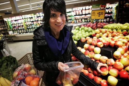 Registered dietitian Gina Sunderland says that healthy foods can be cheaper than unhealthy junk foods. To prove her point she went shopping for her family and filled one cart healthy foods and another with less healthy foods.  130318 March 18, 2013 Mike Deal / Winnipeg Free Press