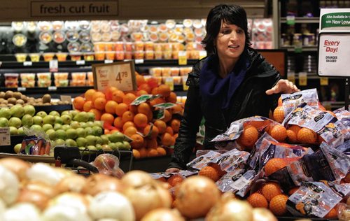 Registered dietitian Gina Sunderland says that healthy foods can be cheaper than unhealthy junk foods. To prove her point she went shopping for her family and filled one cart healthy foods and another with less healthy foods.  130318 March 18, 2013 Mike Deal / Winnipeg Free Press