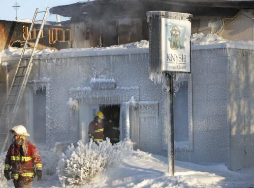 Firefighters check for hot spots after an overnight fire destroyed the Knysh Funeral Chapel on Park Ave. in Beausejour Mb. Tuesday morning. Ashley Prest story (WAYNE GLOWACKI/WINNIPEG FREE PRESS) Winnipeg Free Press March 19 2013