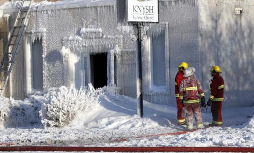 Firefighters check for hot spots after an overnight fire destroyed the Knysh Funeral Chapel on Park Ave. in Beausejour Mb.Tuesday morning.Ashley Prest story (WAYNE GLOWACKI/WINNIPEG FREE PRESS) Winnipeg Free Press March 19 2013