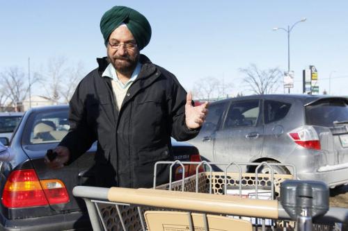 March 19, 2013 - 130319  -  Pritan Brar talks to a reporter about immigartion on Keewatin Tuesday, March 19, 2013. John Woods / Winnipeg Free Press