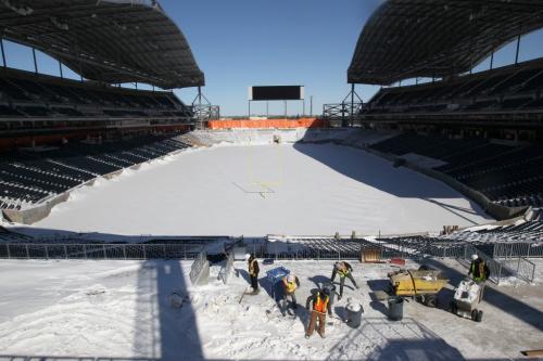 Crews clear snow inside the new Investors Group Field that is under construction- The new stadium will be home to the Winnipeg Blue Bombers for the 2013 season-See Paul Wiecek story- March 08, 2013   (JOE BRYKSA / WINNIPEG FREE PRESS)