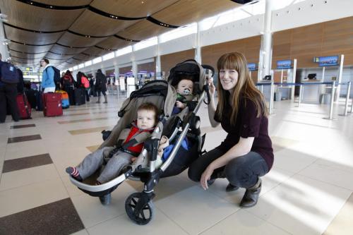 OUR WINNIPEG , Kathleen Cook  with her twin sons in stroller  (bottom) Dylan , top Rhys 10 months  at James Richardson International Airport - Sunday Xtra KEN GIGLIOTTI / Mar. 21 2013 / WINNIPEG FREE PRESS