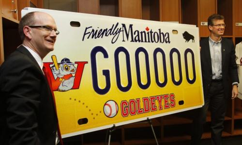 At left, Andrew Collier,GM of the Winnipeg Goldeyes and Andrew Swan, Justice Minister unveiled the design of the new Winnipeg Goldeyes' specialty licence plate at Shaw Park Friday. The new plates will cost $70, with $30 of the purchase going to the Winnipeg Goldeyes' Field of Dreams Foundation.   Melissa Martin story (WAYNE GLOWACKI/WINNIPEG FREE PRESS) Winnipeg Free Press March 22 2013