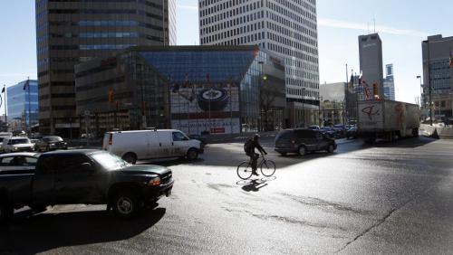STDUP - The Spring sun is bringing a grudging steady melt , with Friday temps daytime High  at -3 , the weekend -2 for Sat and Sunday , the warmer temps are bringing out more cyclists  as road conditions  improve -  KEN GIGLIOTTI / Mar. 22 2013 / WINNIPEG FREE PRESS