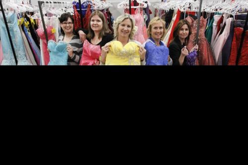 Volunteer Lorraine Penman (centre) chairs the Gowns For Grads program, which supplies dresses, accessories, jewellery and a swag bag to girls who register for the program. Penman stresses the importance of her volunteer crew, including (from left to right) Erin Herkimer, Lesa Campbell, Margot Kalinowski and Daphne Eva, among others. There are already more than 400 girls registered, and there will be an array of colourful dresses to choose from at the event which is to be held at the Convention Centre from April 3-5, 2013. Friday, March 22, 2013. (REPORTER: CAROLYN SHIMMIN) (JESSICA BURTNICK/WINNIPEG FREE PRESS)