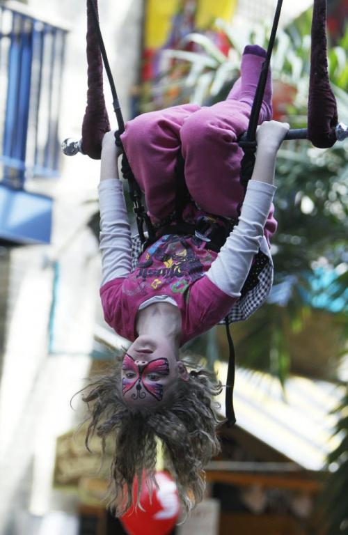 Cecilia Swart, 6, tries out the trapeze, at The Festival of Fools, at The Forks, Saturday, March 23, 2013. ( TREVOR HAGAN/WINNIPEG FREE PRESS)
