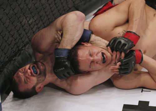 March 23, 2013 - 130323  -  Mitch Fryia chokes Dwight Sutherland   in the Aggression Fighting Championships mixed martial arts competition at the Winnipeg Convention Centre Saturday, March 23, 2013. John Woods / Winnipeg Free Press